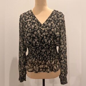 Floral over black long sleeved women’s blouse